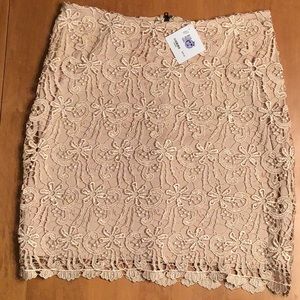 Above the knee lace overlay skirt.